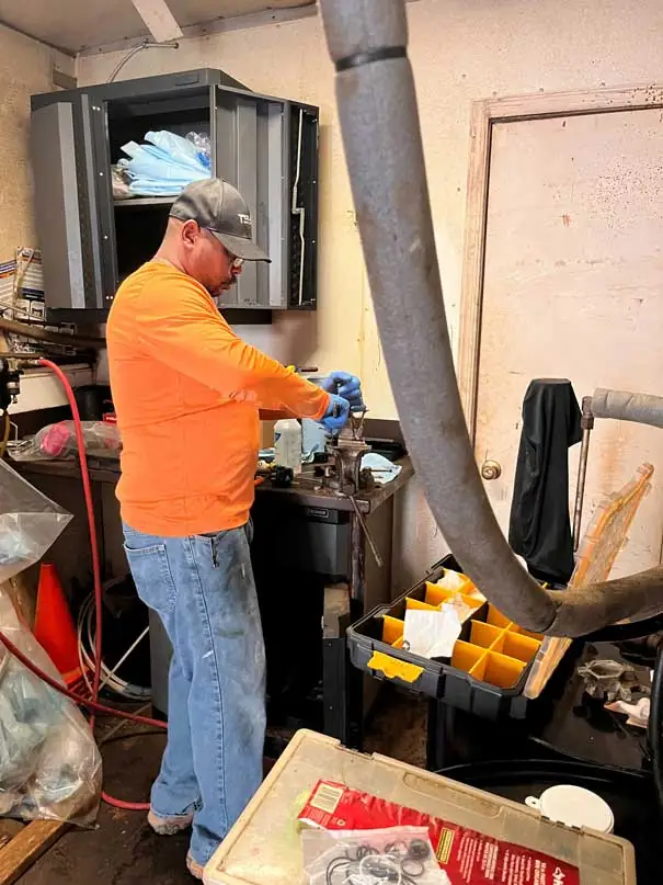 Spray Foam Technician: Curtis Wyche working on his equipment.