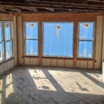 Open wall framing insulated with closed-cell spray foam in a newly constructed home.
