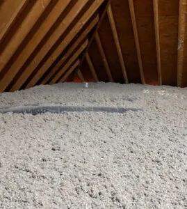 Attic insulation with cellulose insulation.