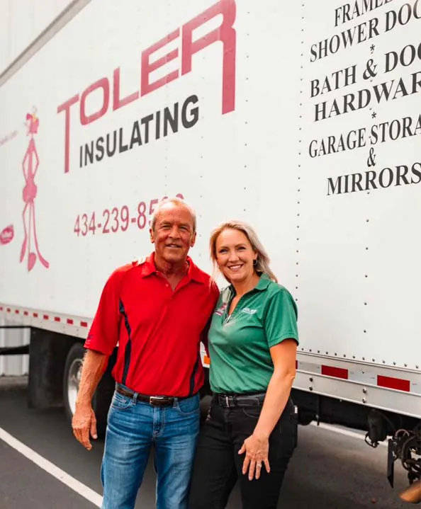 Morgan Toler and her father, posing in front of a Toler work truck.